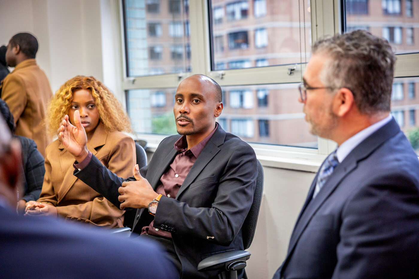 Emmanuel in a roundtable discussion